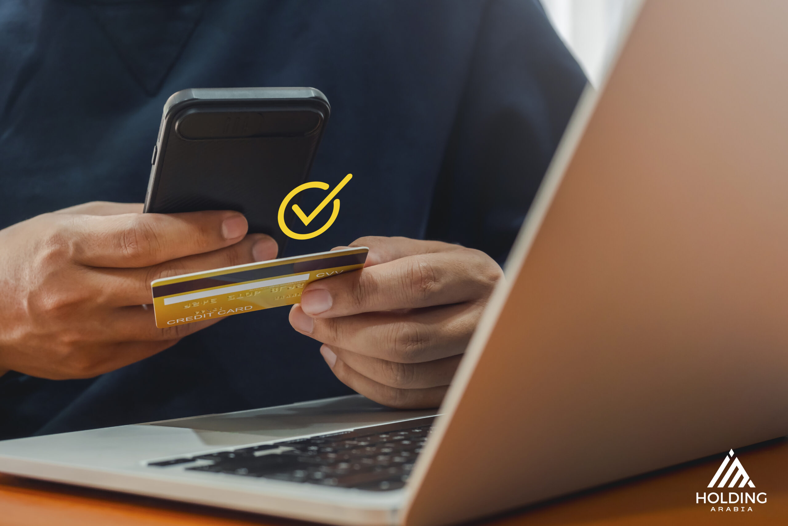someone checking his credit card to purchase a certain service on an ecommerce website